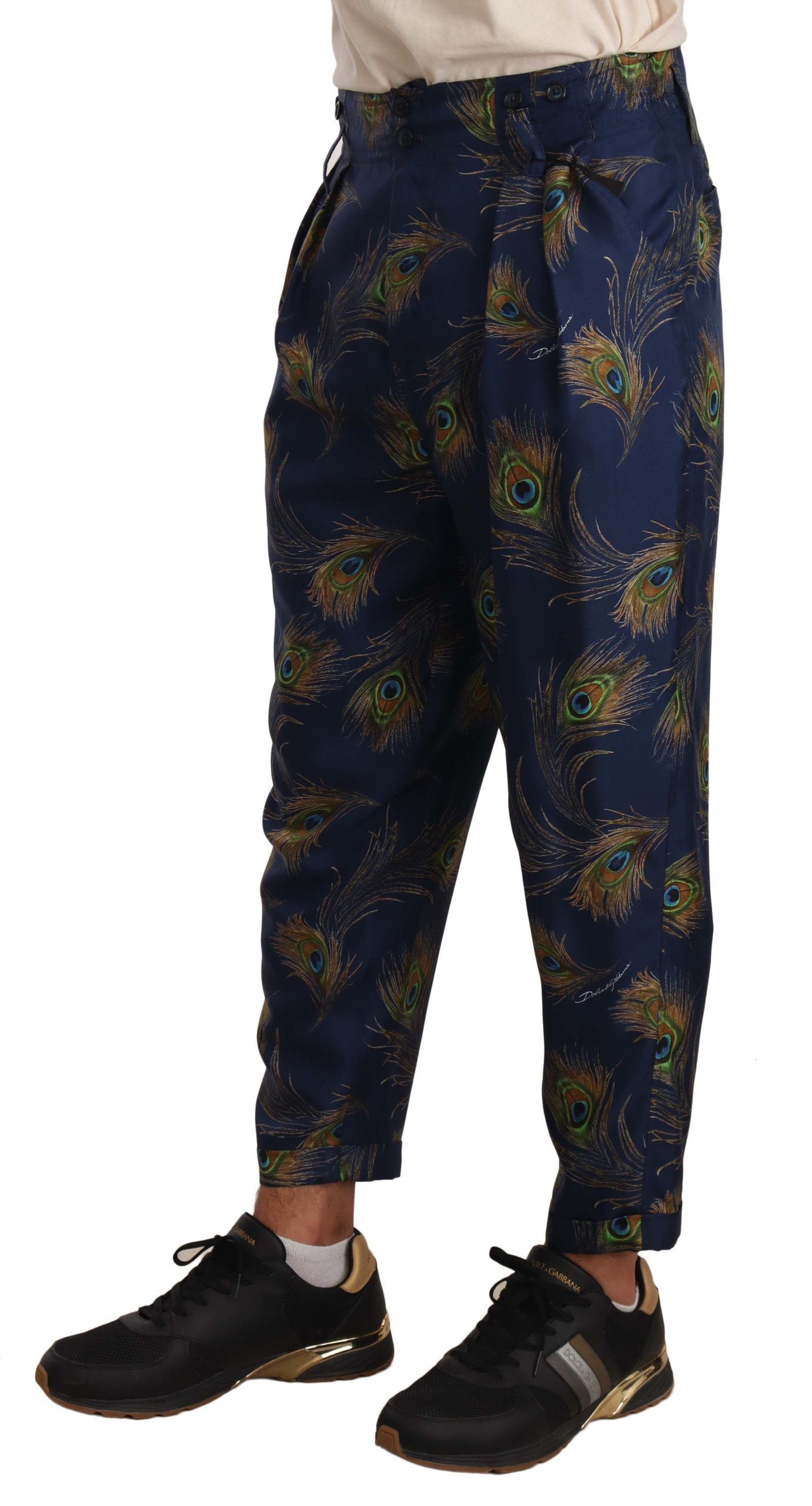 Dolce & Gabbana – Karottenhose aus Seide mit blauem Pfauenmuster