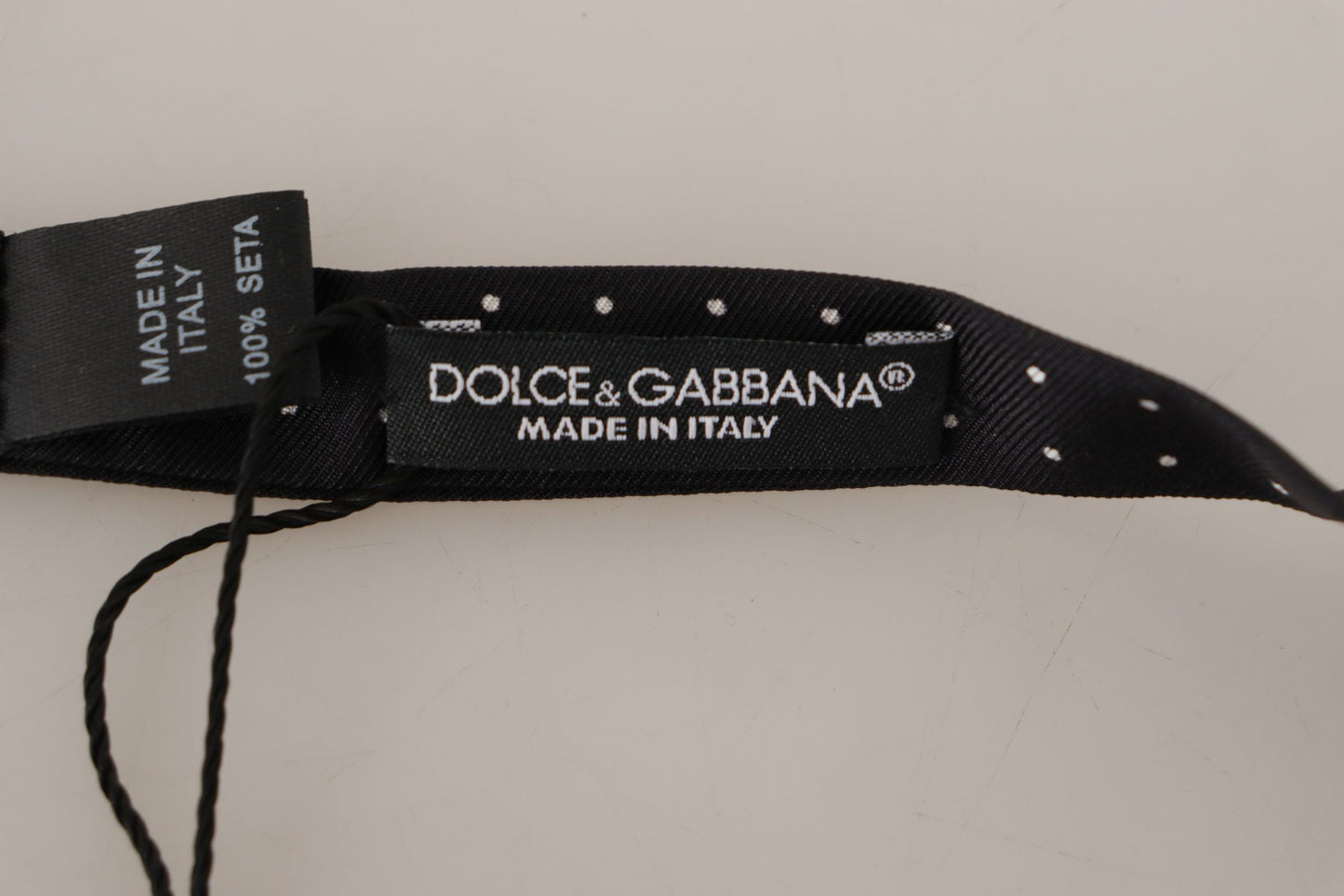 Dolce & Gabbana – Schwarz-weiß gepunktete Papillon-Krawatte aus 100 % Seide