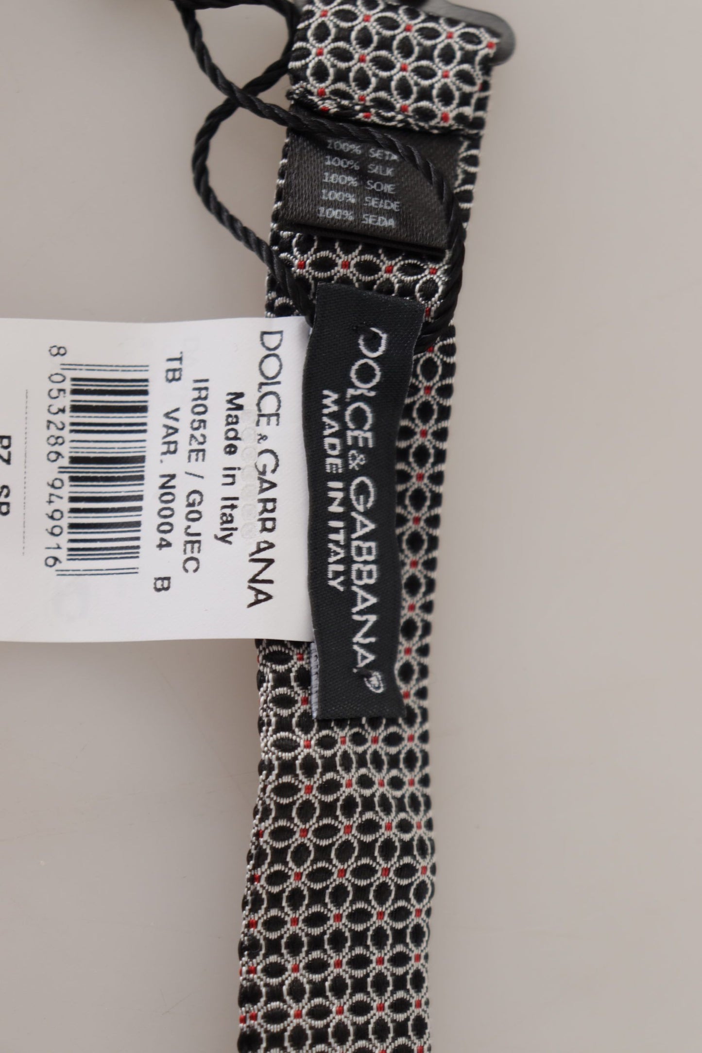 Dolce & Gabbana – Schwarz-weiße Seidenkrawatte mit Blumenmuster und Papillon-Muster
