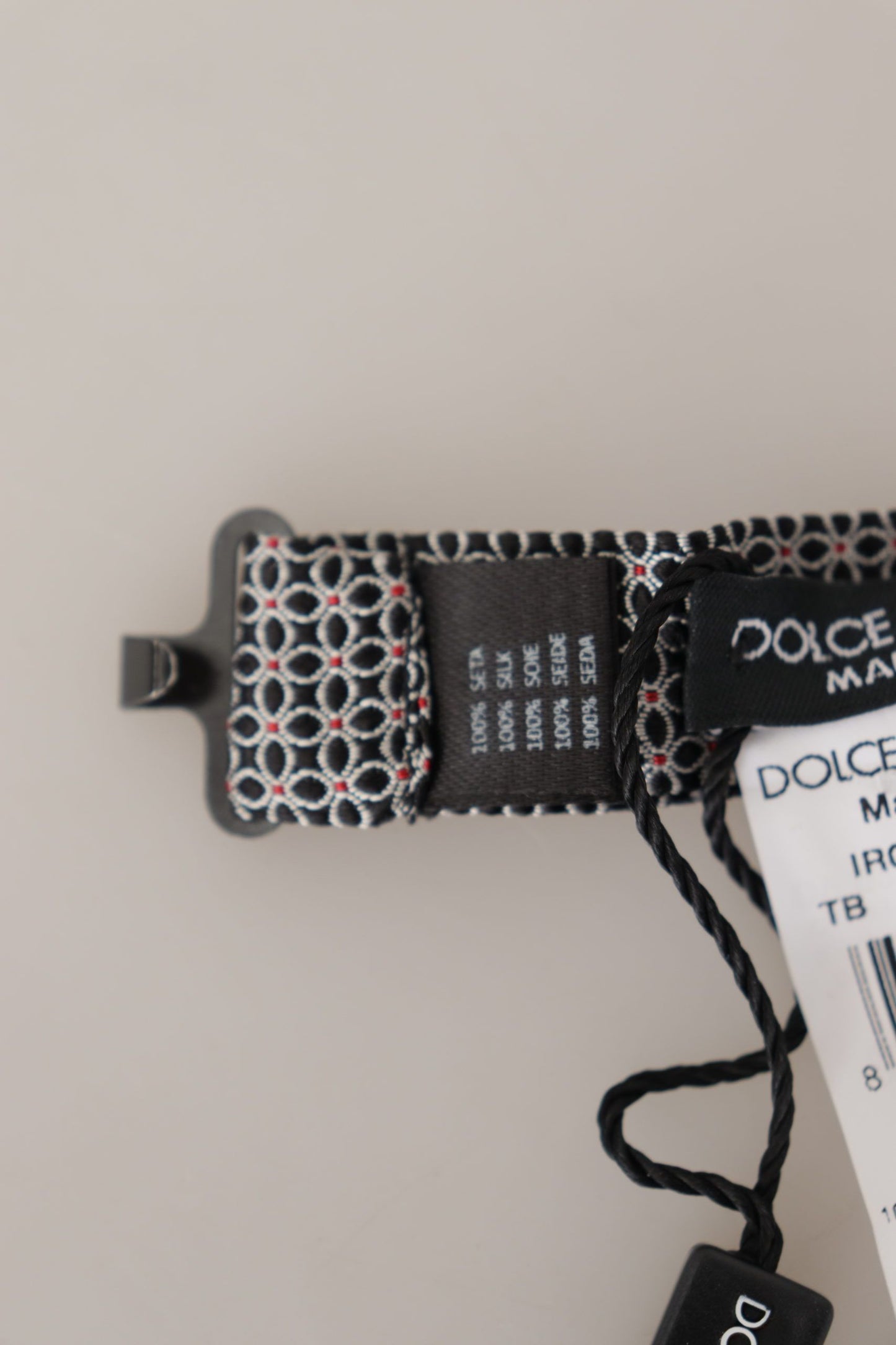 Dolce & Gabbana – Schwarz-weiße Seidenkrawatte mit Blumenmuster und Papillon-Muster