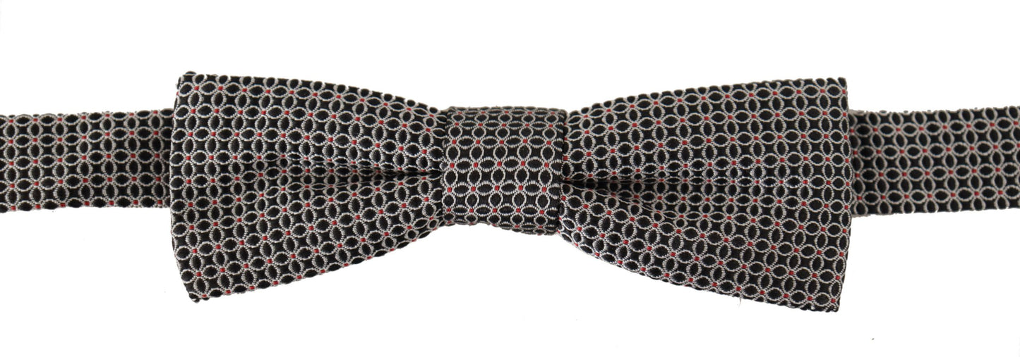 Dolce & Gabbana – Schwarz-weiße Seidenkrawatte mit Blumenmuster und Papillon-Muster