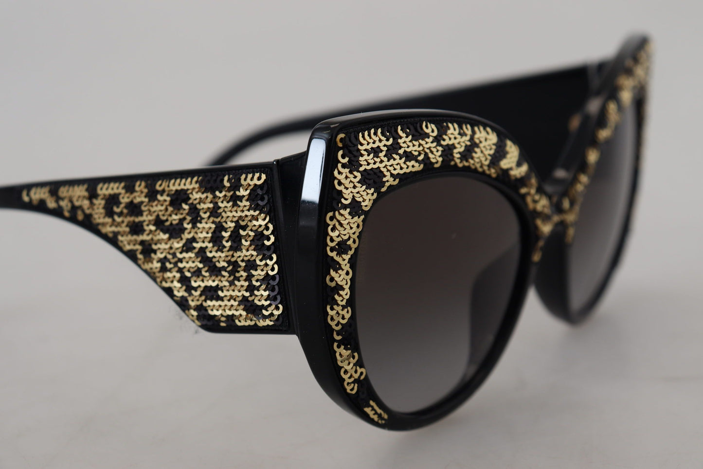 Dolce & Gabbana – Polarisierte Sonnenbrille DG4326 mit Schmetterlingsmotiv und schwarzen Goldpailletten