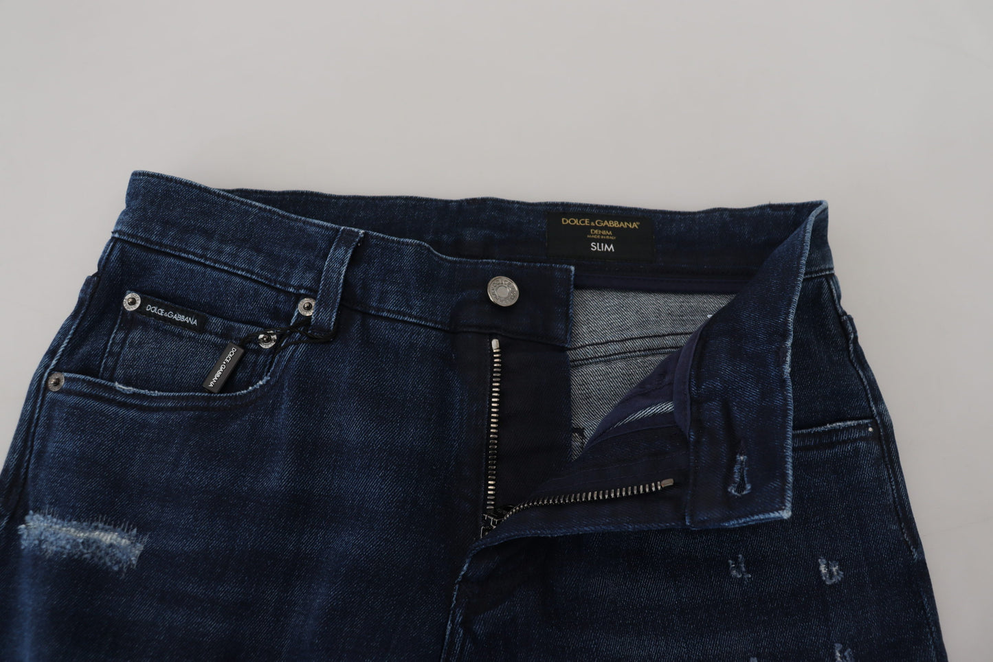 Dolce & Gabbana – Skinny-Jeans aus zerfetztem Baumwoll-Denim in Blau