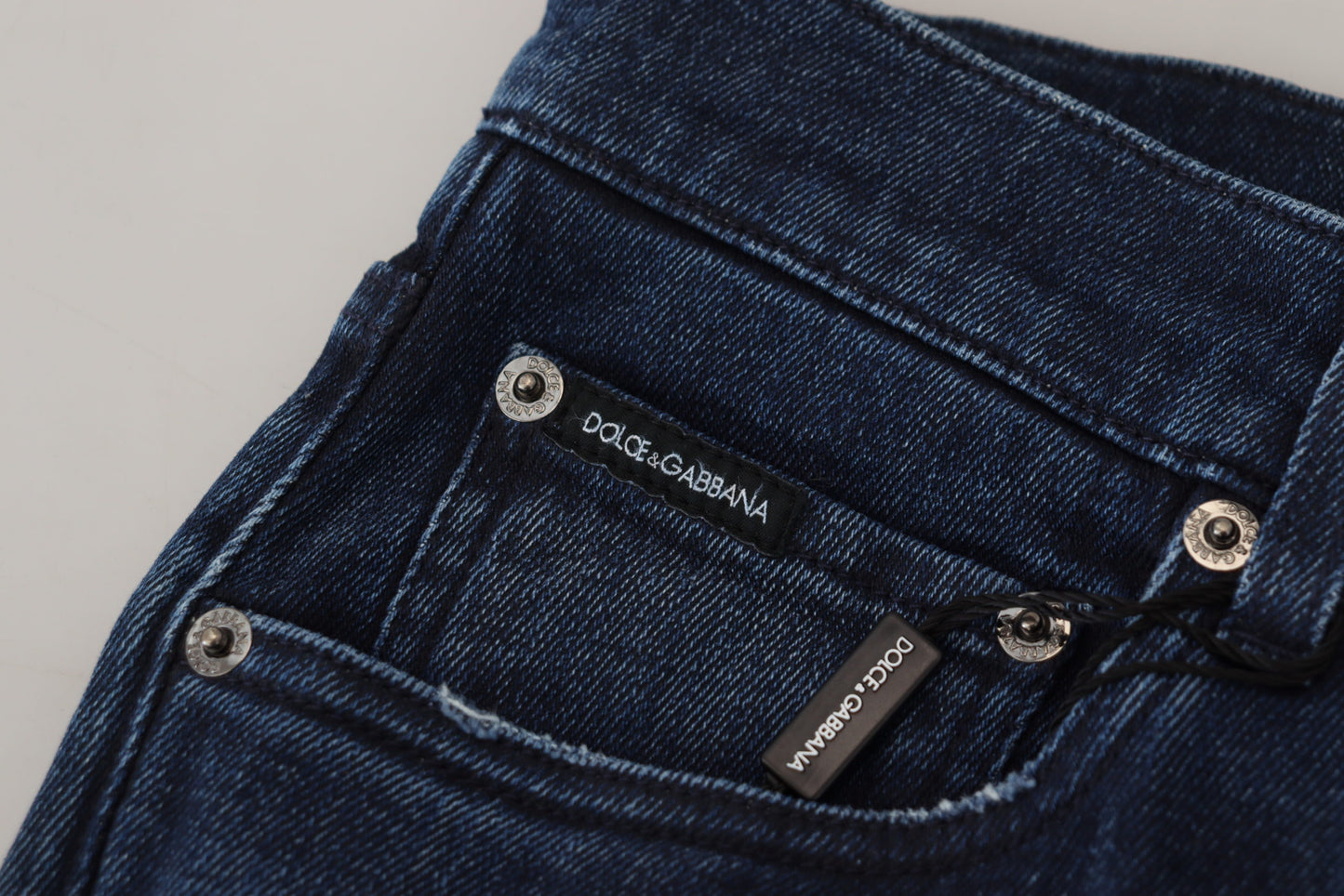 Dolce & Gabbana – Skinny-Jeans aus zerfetztem Baumwoll-Denim in Blau