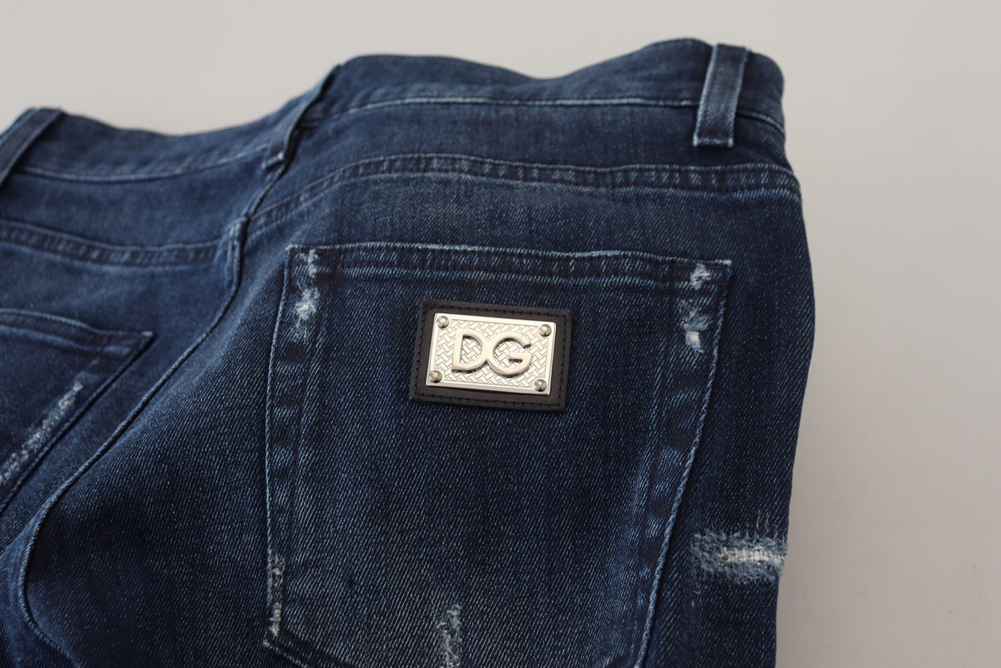 Dolce & Gabbana – Skinny-Jeans aus zerfetztem Baumwoll-Denim in Blau