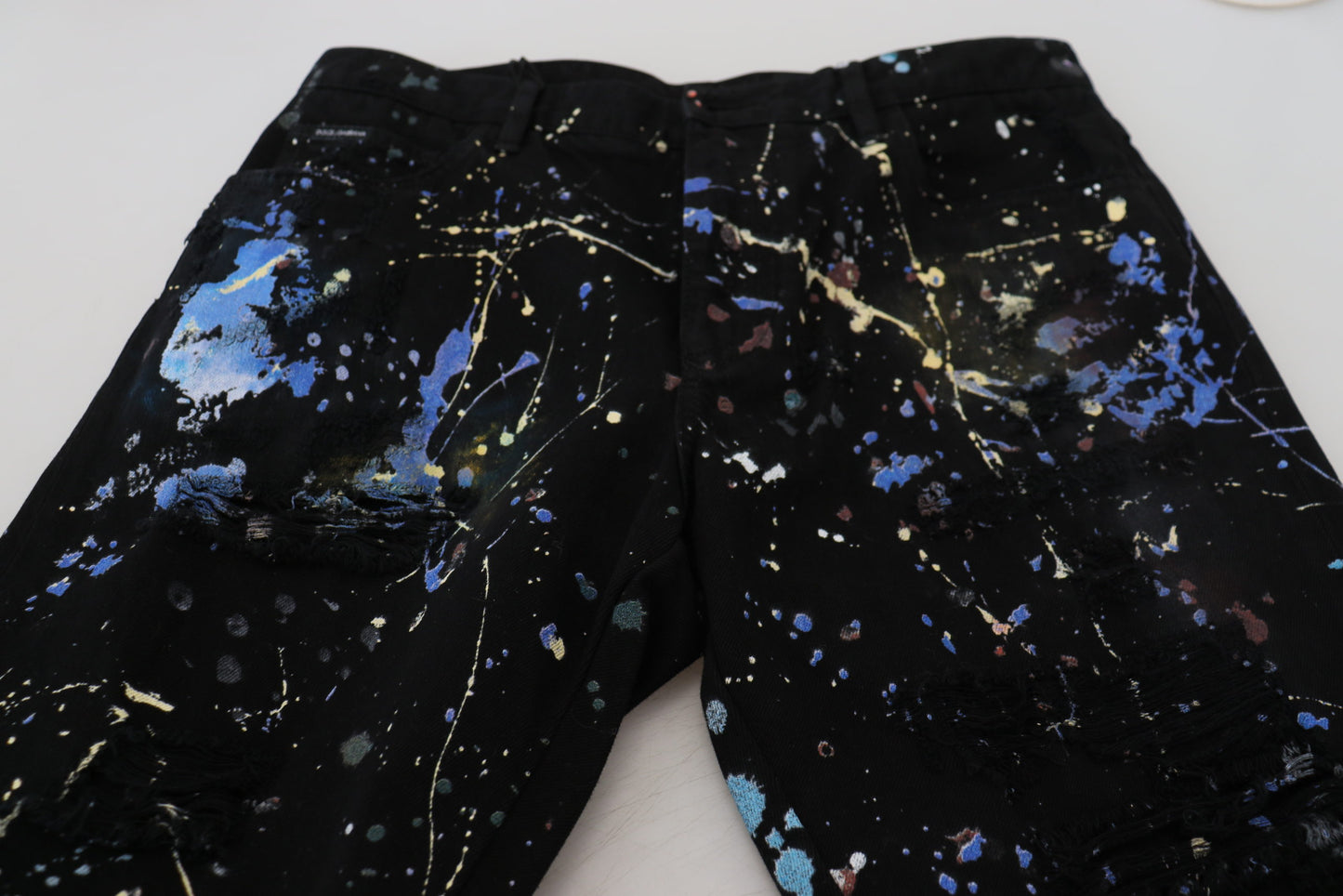 Dolce & Gabbana – Schwarze Jeans aus Baumwoll-Denim mit Farbspritzer-Print