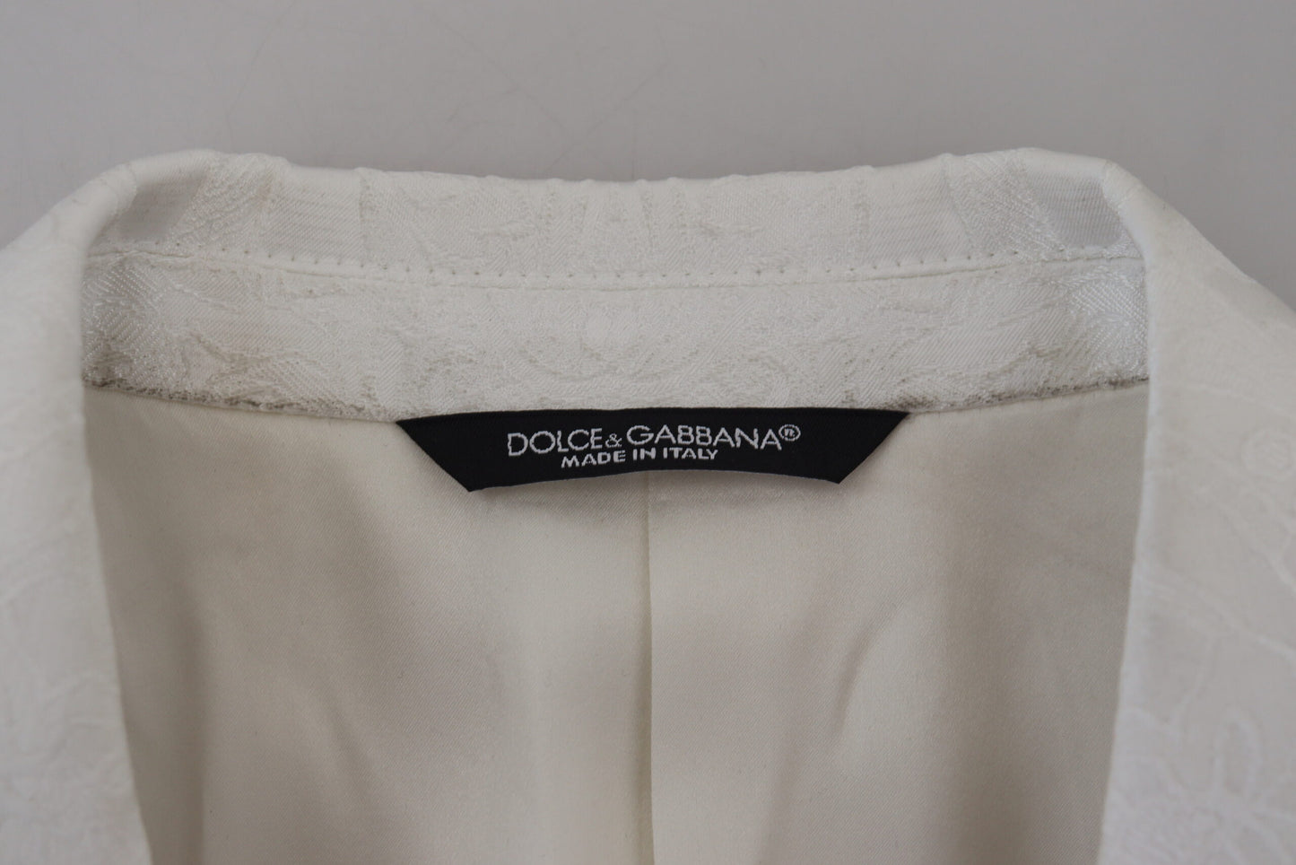 Dolce & Gabbana – Trenchcoatjacke aus weißem Brokat mit Blumenmuster