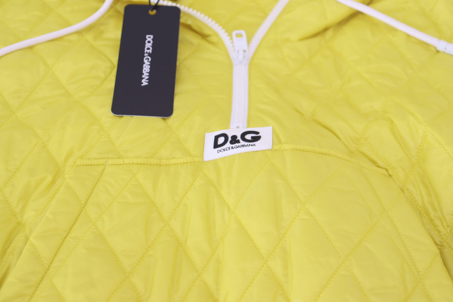 Dolce & Gabbana – Gelbe, gesteppte Pulloverjacke aus Nylon mit Kapuze