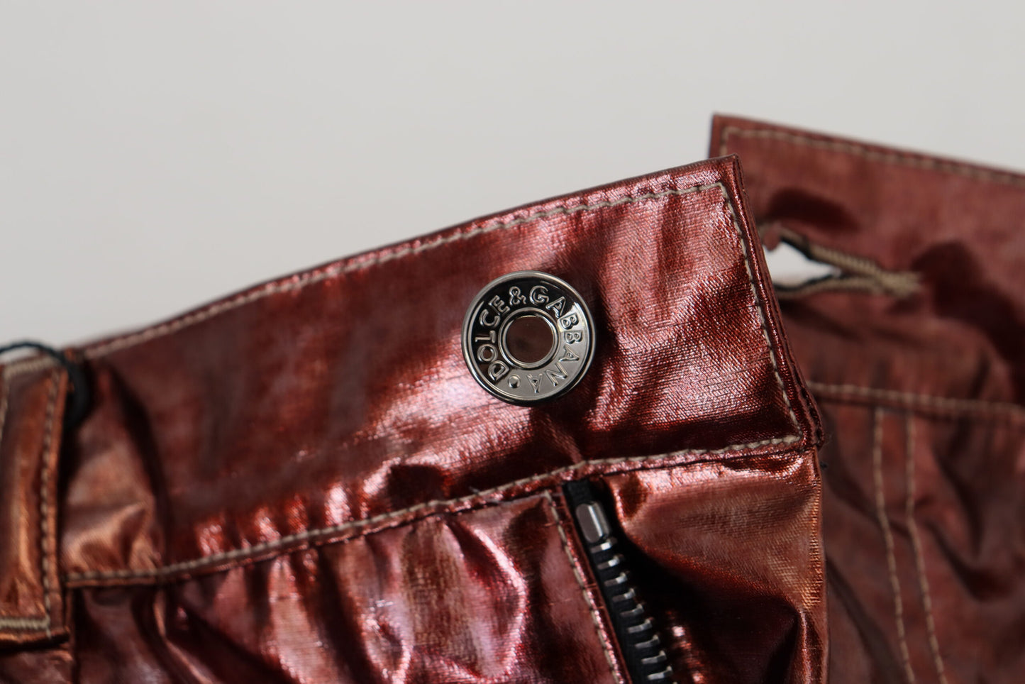 Dolce & Gabbana – Enge Jeans mit hoher Taille in Metallic-Bronze