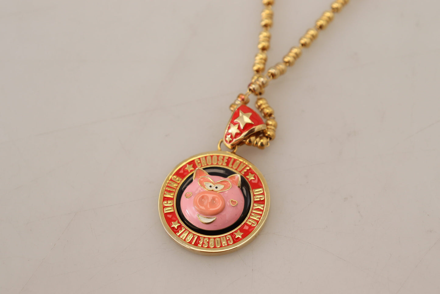 Dolce & Gabbana – Halskette mit Logo und Anhänger „Super Pig“ aus goldenem Messing