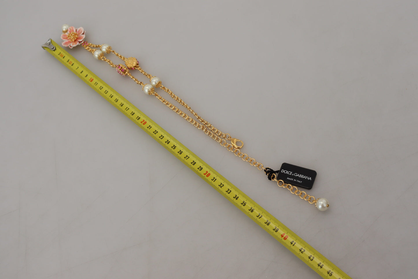 Dolce & Gabbana – Goldfarbene Halskette mit floralen Kristallen und rosa Verzierung