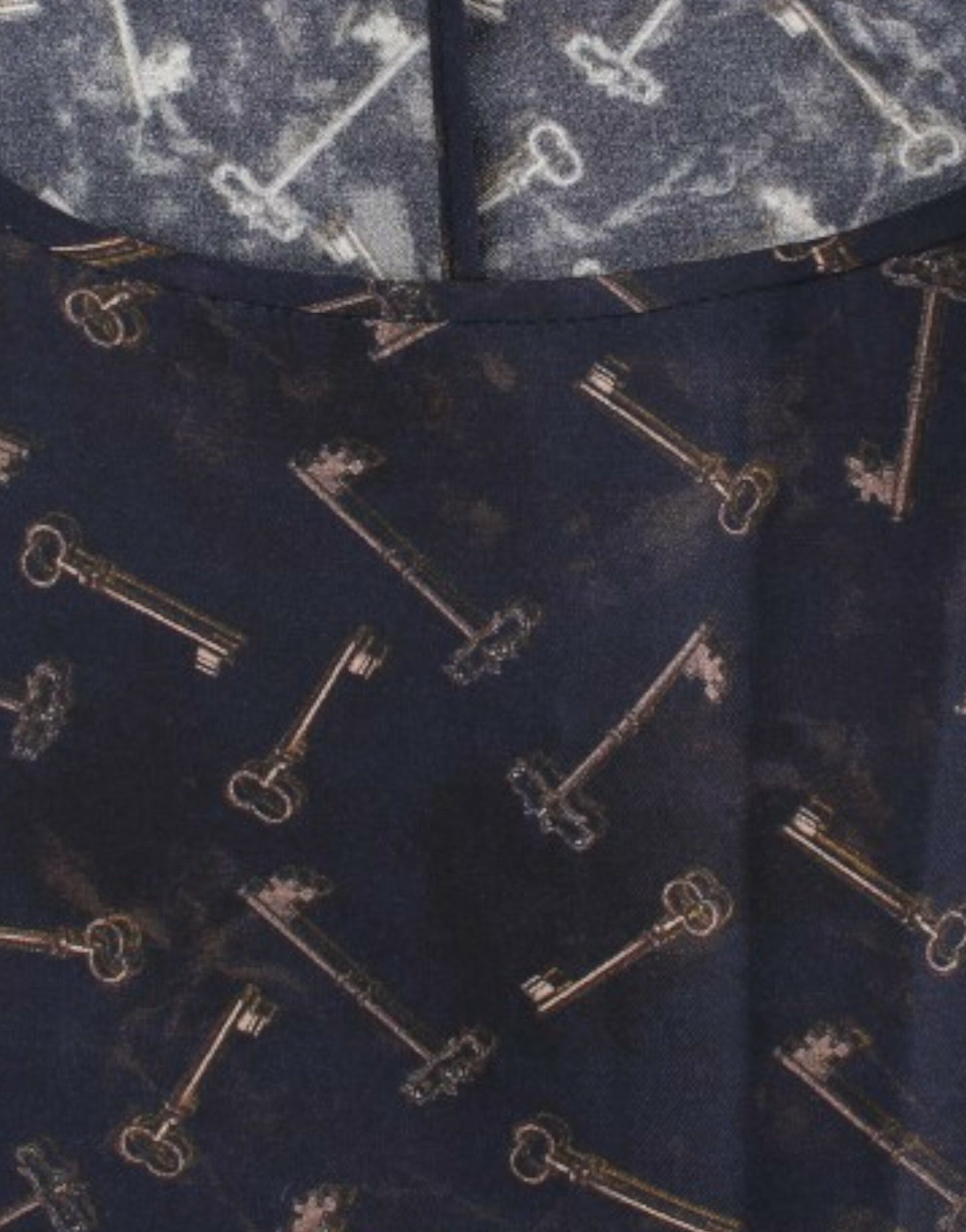 Dolce & Gabbana Blaue Seidenbluse mit goldenem Schlüsseldruck