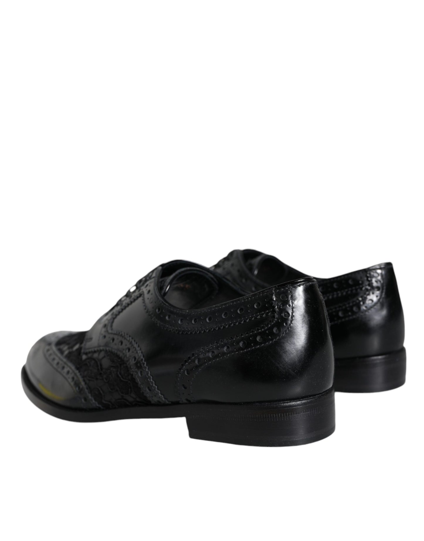 Dolce & Gabbana – Formelle Schuhe aus schwarzem Leder mit floraler Spitze