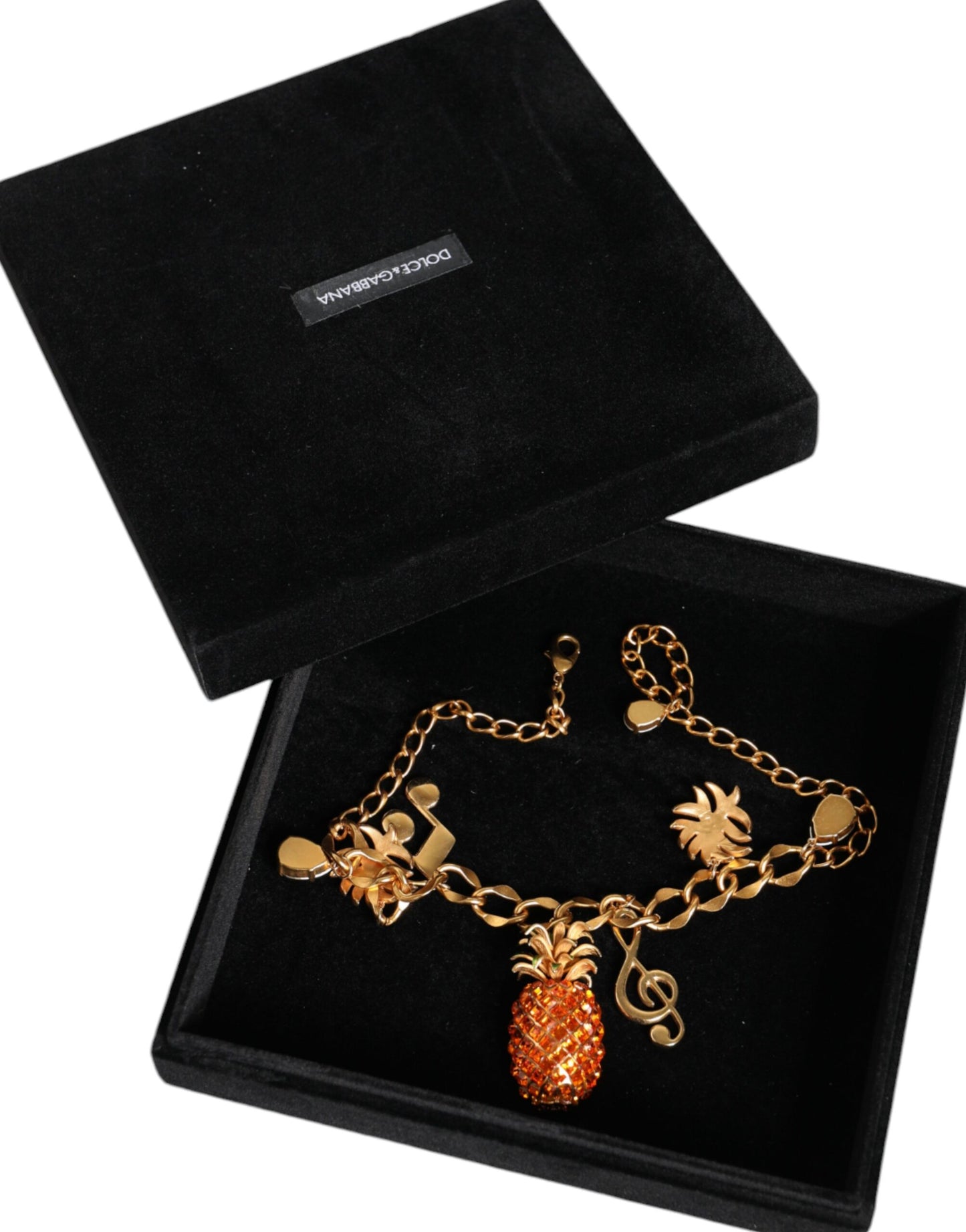 Dolce & Gabbana – Goldfarbene Messingkette mit Ananas-Kristall und Musik-Anhänger