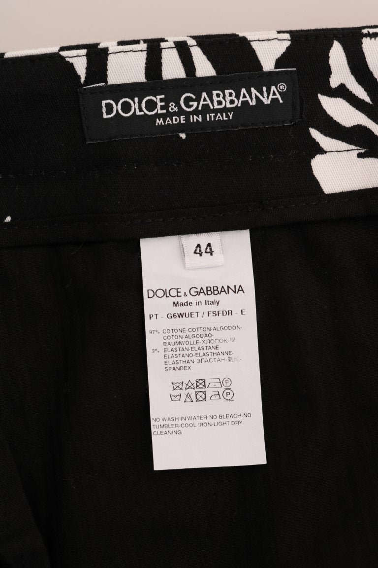 Dolce & Gabbana – Schmale Hose aus Baumwollstretch in Weiß und Schwarz mit Blattmuster