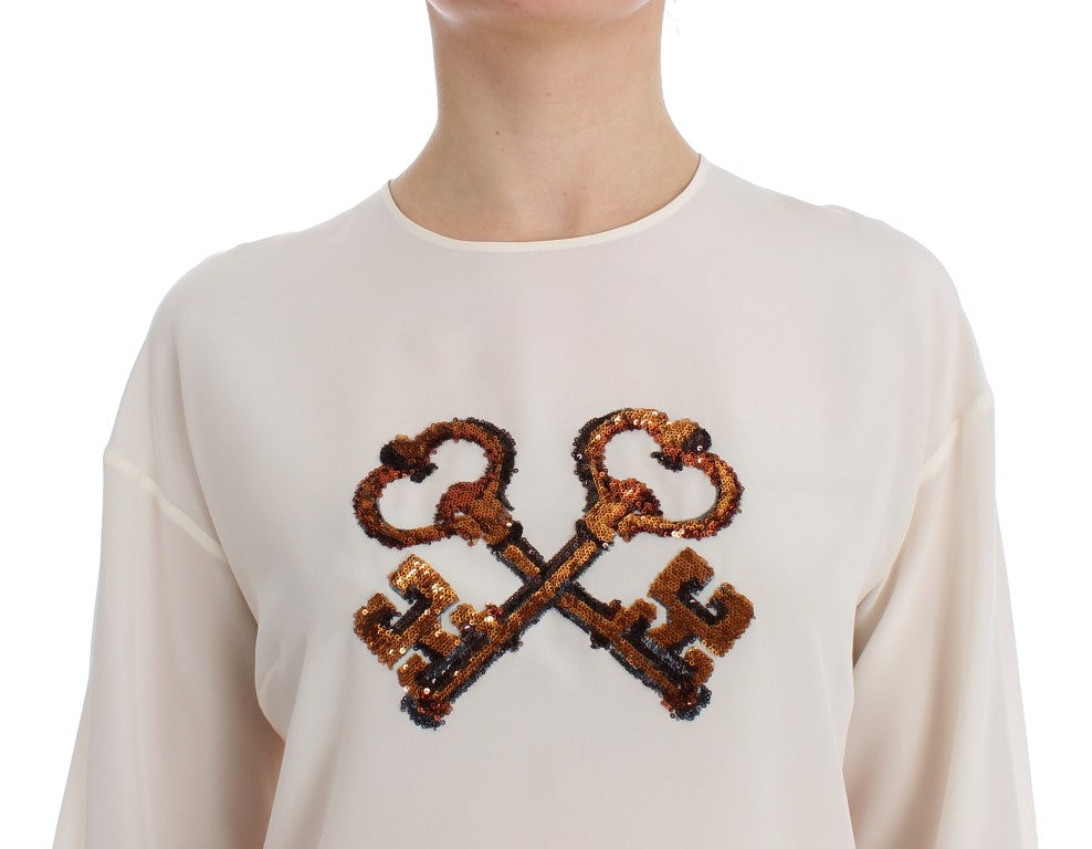 Dolce & Gabbana – Weiße Seidenbluse mit Pailletten und Schlüsseldesign, T-Shirt-Oberteil