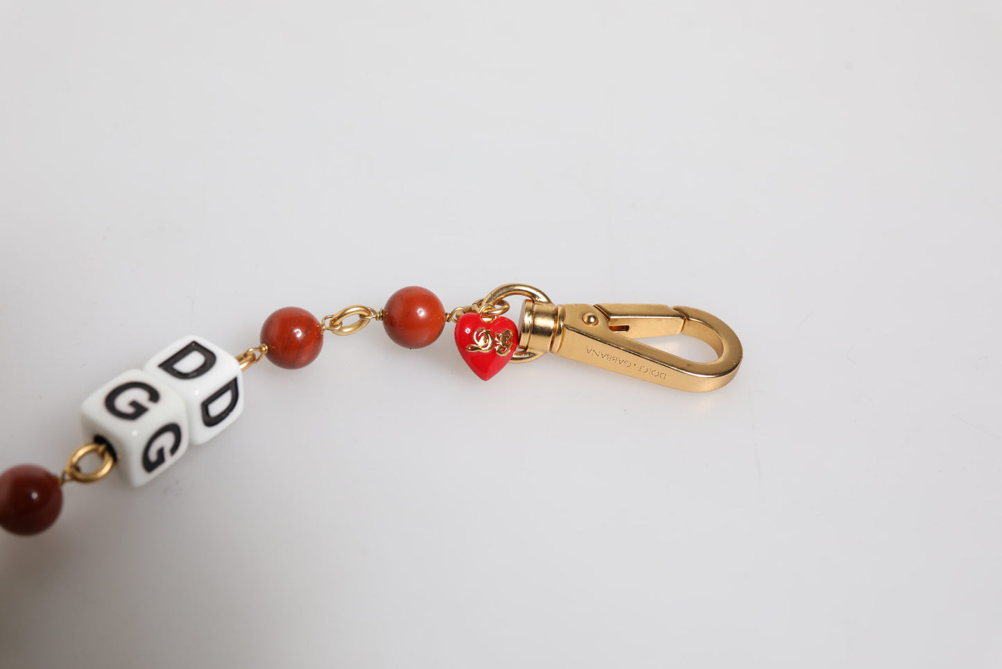 Dolce & Gabbana – Mehrfarbiges, goldfarbenes Messingkettenarmband mit DG-Logo und Würfeln