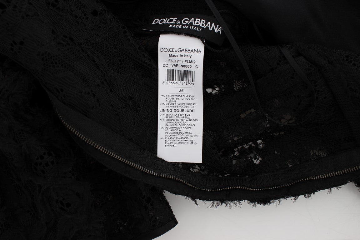 Dolce & Gabbana – Langes, figurbetontes Maxikleid aus geblümter Spitze in Schwarz