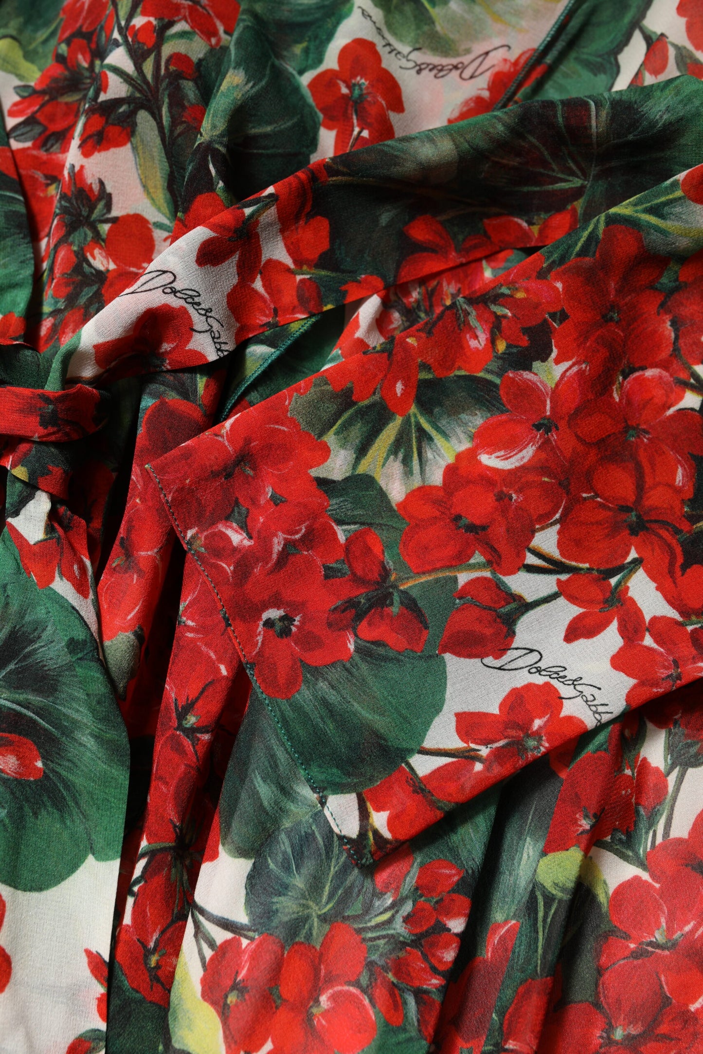 Dolce & Gabbana – Mehrfarbiges, geblümtes Kleid mit langen Ärmeln und V-Ausschnitt
