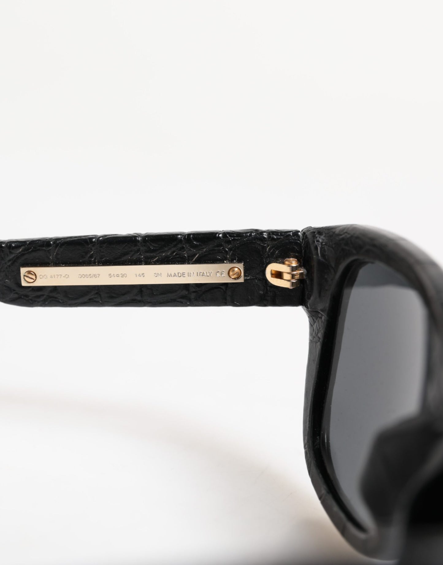 Dolce & Gabbana – Sonnenbrille mit getönten Gläsern und schwarzem Lederrahmen DG4177