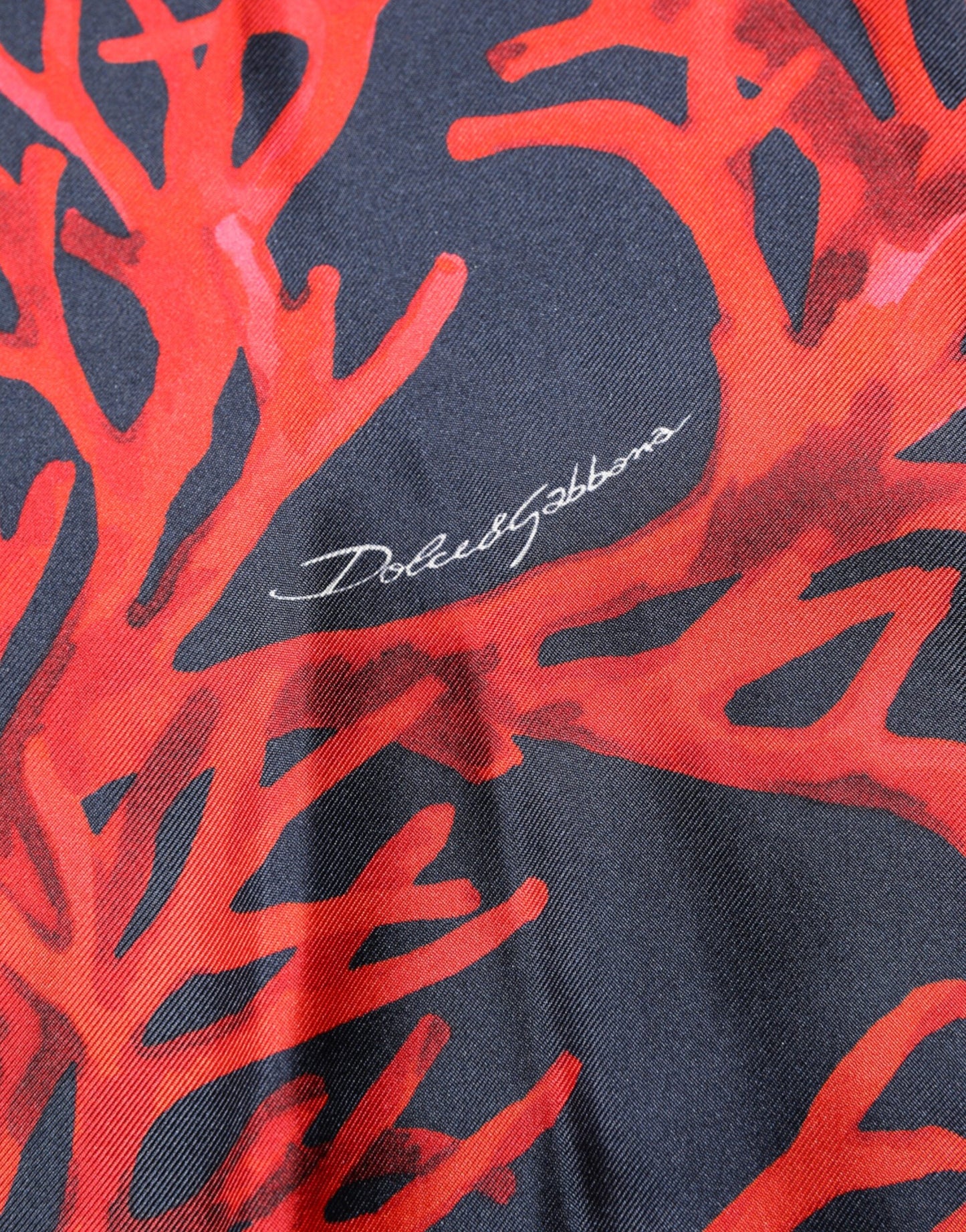 Dolce & Gabbana Marineblauer Pullover aus Seide mit Korallendruck