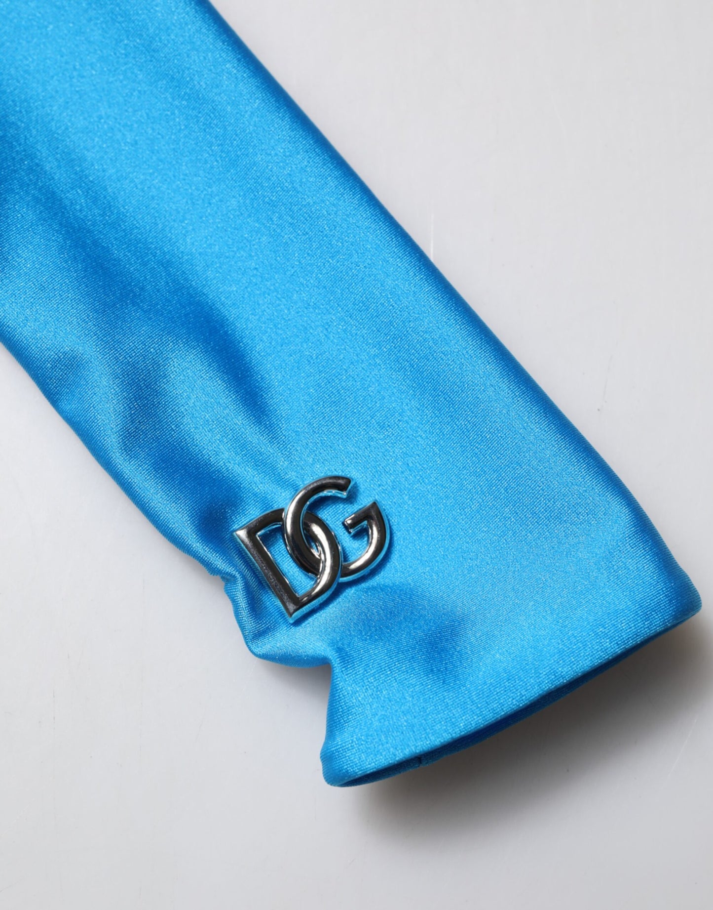 Dolce & Gabbana, blaues, figurbetontes Jumpsuit-Kleid aus Nylon mit Rollkragen