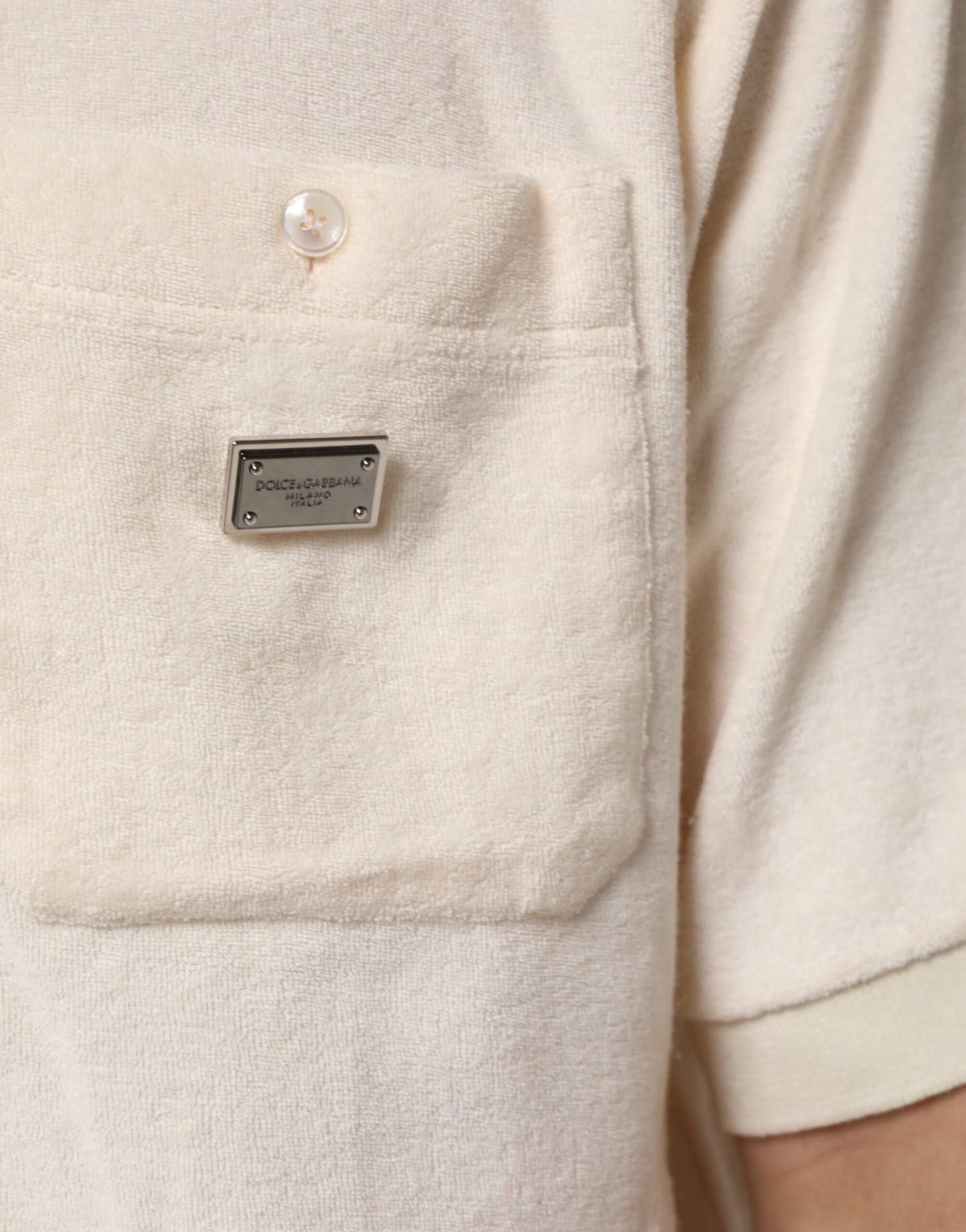 Dolce & Gabbana – Elfenbeinfarbenes Poloshirt aus Baumwollfrottee mit Logotasche