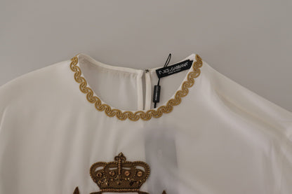 Dolce &amp; Gabbana Blusentop aus weißer Seide mit goldener DG-Krone und Kristallen