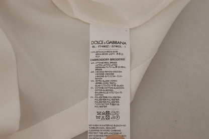 Dolce &amp; Gabbana Blusentop aus weißer Seide mit goldener DG-Krone und Kristallen