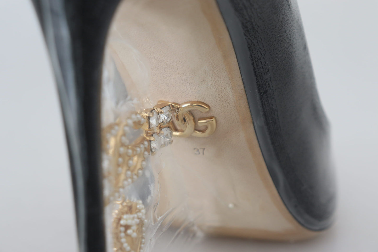 Dolce &amp; Gabbana Schwarze Pumps aus Leder mit Kunststoffummantelung