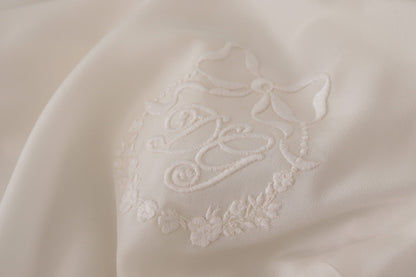 Dolce &amp; Gabbana – Weiße Bluse aus Seide mit DG-Logo-Stickerei und langen Ärmeln