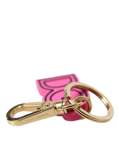 Dolce &amp; Gabbana Schlüsselanhänger mit DG-Logo aus rosa Gummi und goldfarbenem Metall