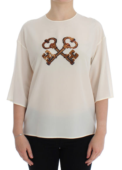 Dolce &amp; Gabbana – Weiße Seidenbluse mit Pailletten und Schlüsseldesign, T-Shirt-Oberteil