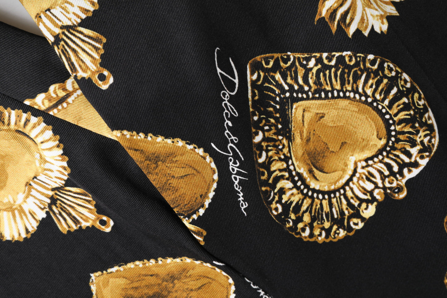 Dolce &amp; Gabbana – Hose mit Herz-Jesu-Print in Schwarz und Gold