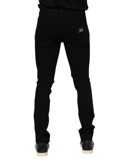Dolce &amp; Gabbana Dunkelblaue Jeans aus Baumwolle mit Logo-Plakette in GOLD