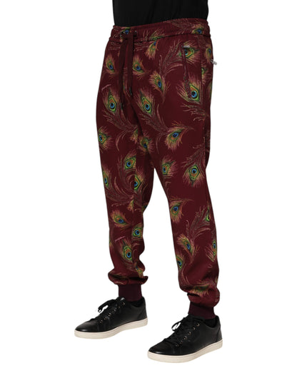 Dolce &amp; Gabbana – Jogginghose mit Pfauenfeder-Print in Burgunderrot