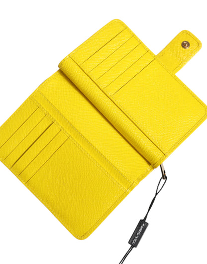Dolce &amp; Gabbana – Zweifach gefaltete Clutch aus gelbem Leder im Continental-Stil